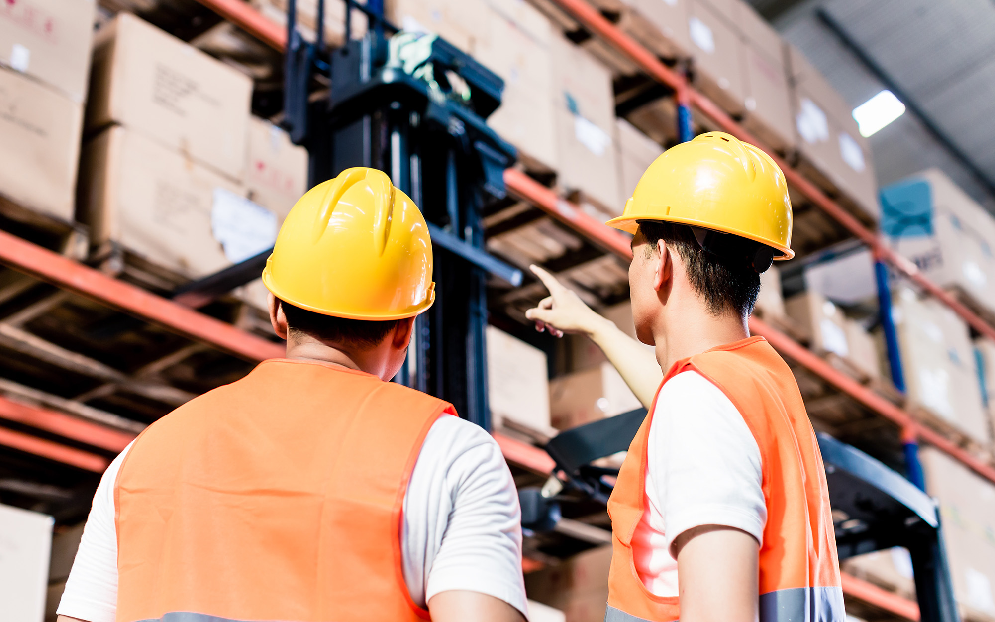 Worker team taking inventory in logistics warehouse