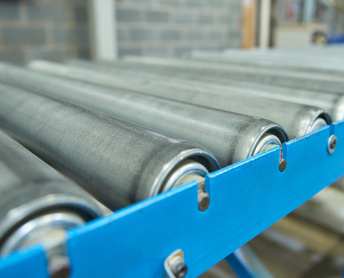 An empty industrial roller conveyor belt in a fully automated factory