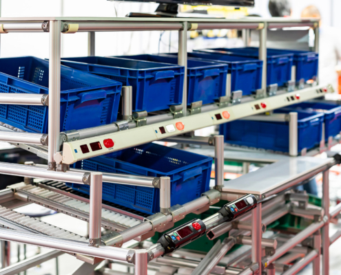 basket or plastic box container on roller rack or aluminum shelf with electronic display smart module system for management